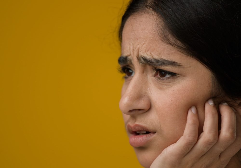 close-up-female-in-studio-yellow-background-indian-2023-01-04-01-33-25-utc